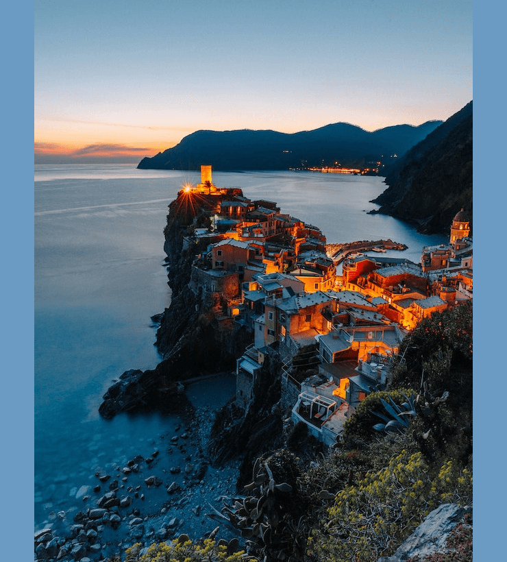 In this example, we remove the side borders from the image of a cozy village on a cliff by the seaside. The left and right borders on this image have a semi-transparent color, giving the image a translucent quality. By removing 50 pixels of border from each side, we eliminate the transparency and obtain a fully opaque image at the output. (Source: Pexels.)