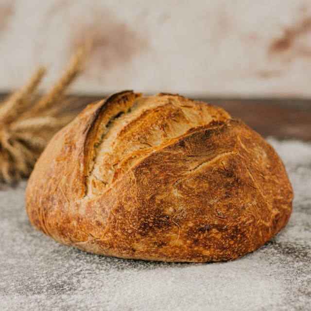 In this example, we create a warm polaroid of freshly baked bread. We frame the image with an antique white border and add the caption "Home smells like this". We place the text on two lines and use the elegant Google font Source Code Pro. We also rotate the polaroid by 15 degrees (a positive angle tilts it counter-clockwise) and add a very sharp (almost not blurry) shadow with a blur radius of 30, shifted 40 pixels down and to the right. (Source: Pexels.)