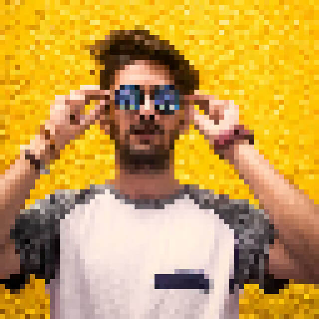 This example applies a fine mosaic effect with a tile size of 10 pixels to a portrait of a man wearing sunglasses. The image instantly transforms into a compact mosaic where each tile represents the average color of the original 100 pixels – 10 pixels wide and 10 pixels high. (Source: Pexels.)