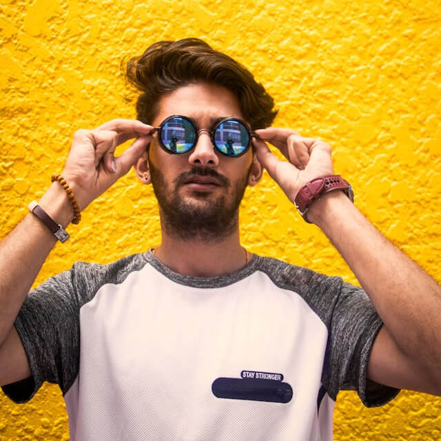 This example applies a fine mosaic effect with a tile size of 10 pixels to a portrait of a man wearing sunglasses. The image instantly transforms into a compact mosaic where each tile represents the average color of the original 100 pixels – 10 pixels wide and 10 pixels high. (Source: Pexels.)