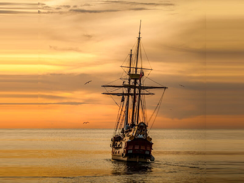 In this example, we create a horizontal image of a pirate ship in custom mode for setting dimensions. We generate a horizontal image sized at 800 by 600 pixels, stretching edge pixels (taking 20 pixels from each side and stretching them to entirely fill the left and right areas). (Source: Pexels.)