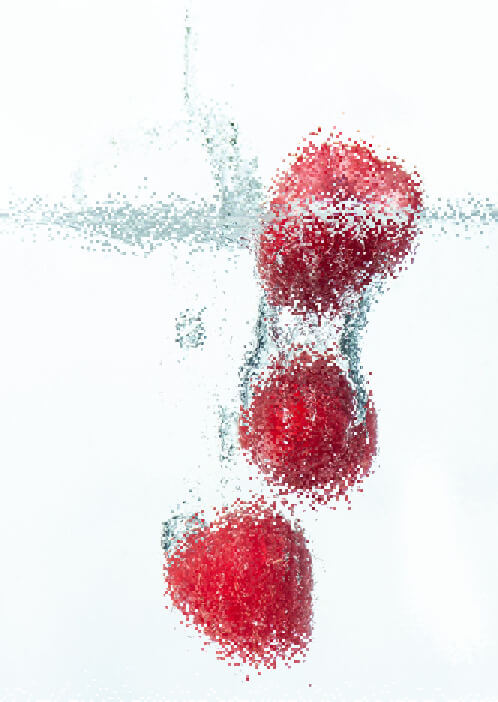 In this example, we use our tool to simulate a pixel diffusion effect, which is also known as a pixel-scattering effect. Pixel diffusion adds a dynamic effect to the image of raspberries falling into water. To create the effect, we activate the column scattering mode and divide the image into pixel groups of size 3×3 pixels. We set the diffusion depth to 6, which means the groups can't shift vertically by more than 6 positions. From all the groups, we select just half of them by setting the probability to 50%. The scattered pixels create a blurred trail of small image fragments along the vertical axis, simulating the motion of raspberries as they fall into the water. (Source: Pexels.)