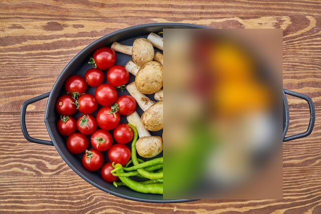 In this example, we share a vibrant image from the kitchen of our restaurant. To avoid revealing all the ingredients of our head chef's signature dish, we apply a blurring effect to half of the ingredients on the plate. We set the blur strength to 35 and censor the yellow pepper, chili, garlic, and onion. (Source: Pexels.)