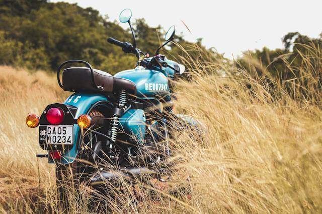 This example hides the license plate on a vintage motorcycle using pixelation. It applies an oval pixelation region to the license plate, using a large pixel size of 20px. As a result, the license plate with numbers is replaced by six large, blurred squares. (Source: Pexels.)