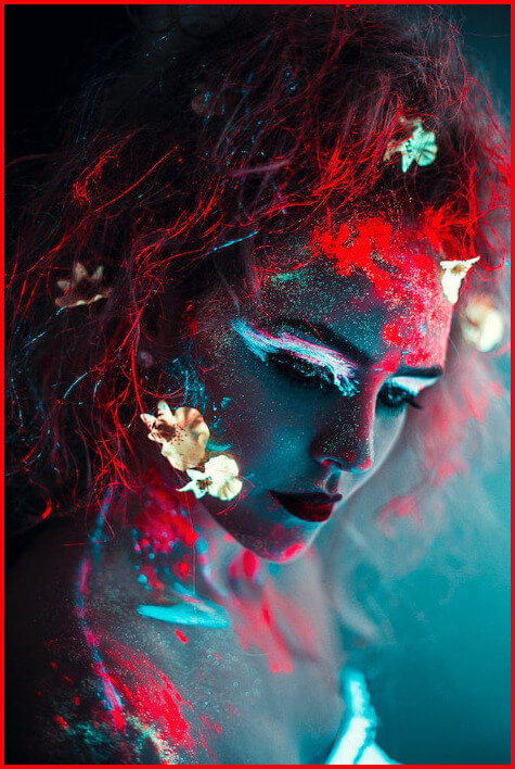 In this example, we use a bright but thin padding to decorate an image of a portrait with neon makeup. We choose a red padding color to match the red neon shadows on the makeup and add 4 pixels of padding to each side of the image. (Source: Pexels.)
