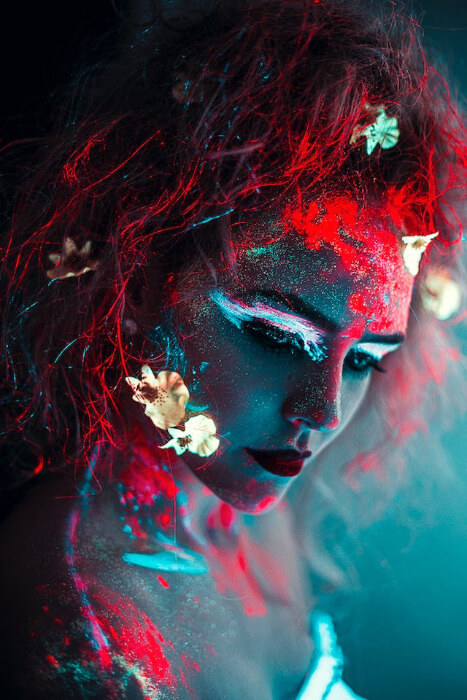 In this example, we use a bright but thin padding to decorate an image of a portrait with neon makeup. We choose a red padding color to match the red neon shadows on the makeup and add 4 pixels of padding to each side of the image. (Source: Pexels.)