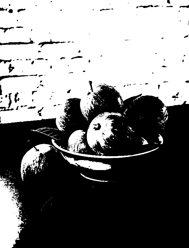 In this example, we transform a colorful WebP image of a bowl of apples into a high-contrast black and white WebP. The tool uses a simple algorithm that compares the color of each pixel to the black and white colors. Pixels that are closer to white are converted to pure white, and pixels that are closer to black are converted to pure black. This method creates a WebP with a sharp contrast between light and dark areas. (Source: Pexels.)