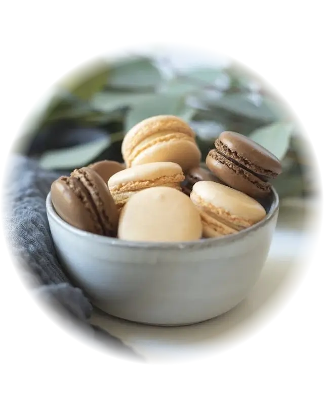 This example uses the radial opacity method to make the bowl of macrons the central focus point of the WebP. The center of the opacity gradient is set to the center of the image, it's directed from the inside out, and its radius is set to 280 pixels. This configuration makes the edges of the WebP transparent while keeping the macarons in the center of the WebP fully visible. (Source: Pexels.)