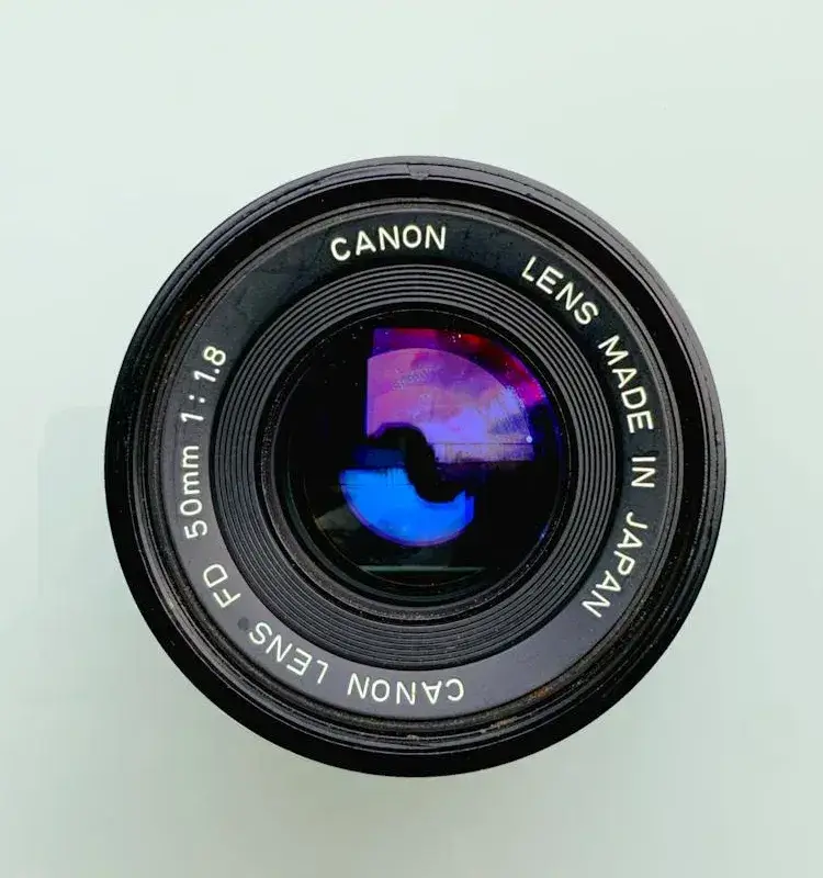 In this example, we enable the "Match External Areas" option to create a transparent area only around a camera lens. This option ensures that only the colors in contact with the outer perimeter of the WebP canvas become transparent. If this option was turned off, then the light-colored letters on the lens wouldn't remain opaque and would also become transparent, which is not what we want. (Source: Pexels.)