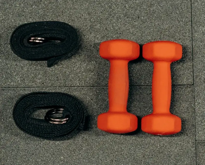 In this example, we extract the dumbbells from a WebP image based on their color. We set the color to "OrangeRed" in the options and adjust the color matching intensity to 45% to include lighter and darker shades of this color in the selection. We leave the background transparent and enable edge smoothing by turning on the anti-alias option with a radius of 2px to make the pixels around the dumbbells semi-transparent. (Source: Pexels.)