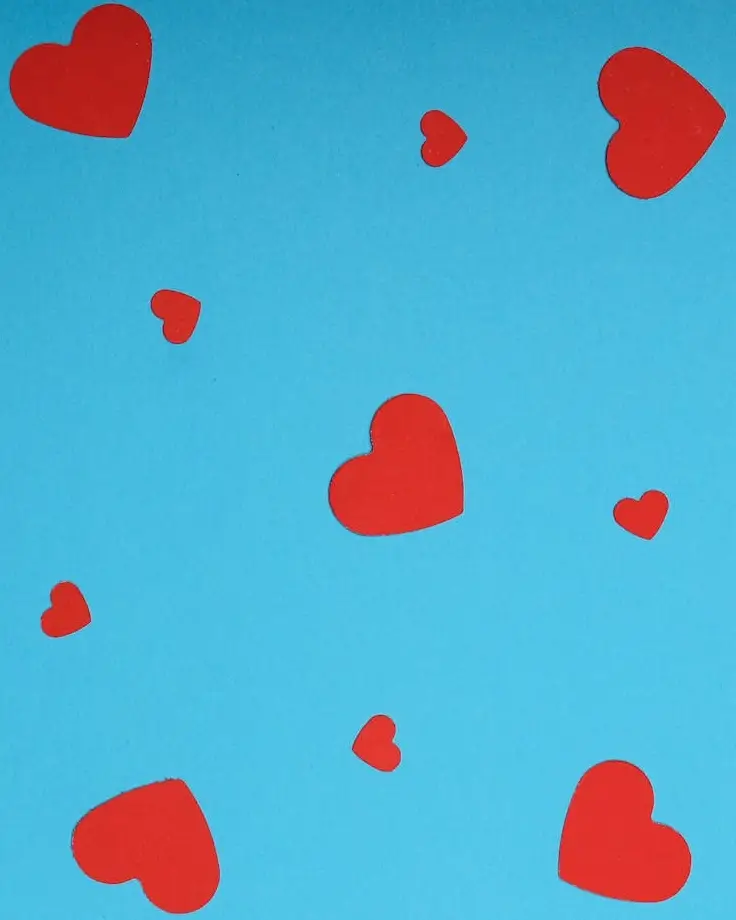 In this example, we convert the red color that is used to paint hearts into the white color. To remove as many shades of red as possible (as you can see there are brighter reds and darker reds), we set the color shade intensity to 60%, which makes sure no red pixels are left in the original image. As a result, the red hearts on the blue background get replaced with white hearts. (Source: Pexels.)