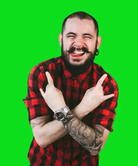 In this example, we upload a WebP photo from a studio portrait session. In this photo, a man in a plaid shirt is posing against a green screen. Our goal is to remove the green background from the photo to create a universal, transparent photo that can be placed on any background in the future. We identify the bright green chroma key via the color hex code "#0cdd1e" and add 20% similar shades to it. We also enable edge smoothing with a 2-pixel radius to minimize green pixels around the edges of the portrait. (Source: Pexels.)