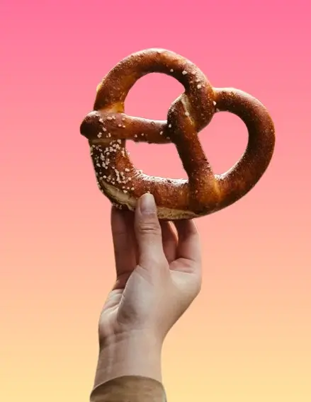 In this example, we remove the transparency from a WebP image of a pretzel and fill the transparent areas with a beautiful linear gradient. The gradient smoothly transitions from light pink (#ff719a) to soft yellow (#ffe29f) through medium pink (#ffa99f). This completely removes transparency from the WebP and adds a bright gradient background to the WebP image. (Source: Pexels.)