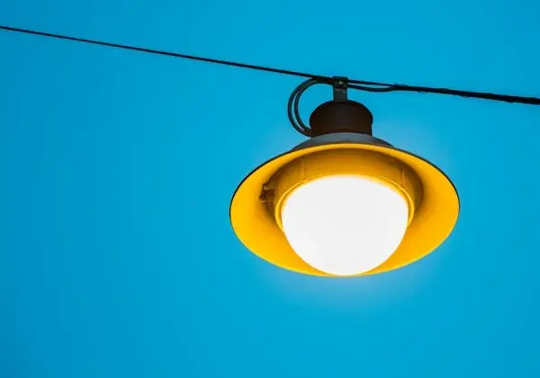 In this example, we remove a gradient background from a WebP image of a yellow hanging lamp. The background color to be removed is a shade of blue "rgb(0, 166, 210)", which we identified by clicking on the input WebP editor. We also remove the slight gradient of the blue shade by setting the color sensitivity option to 20%. Additionally, we add anti-aliasing to the lamp edges (with a radius of 1px) to create a smooth transition between the lamp and the transparent background. (Source: Pexels.)